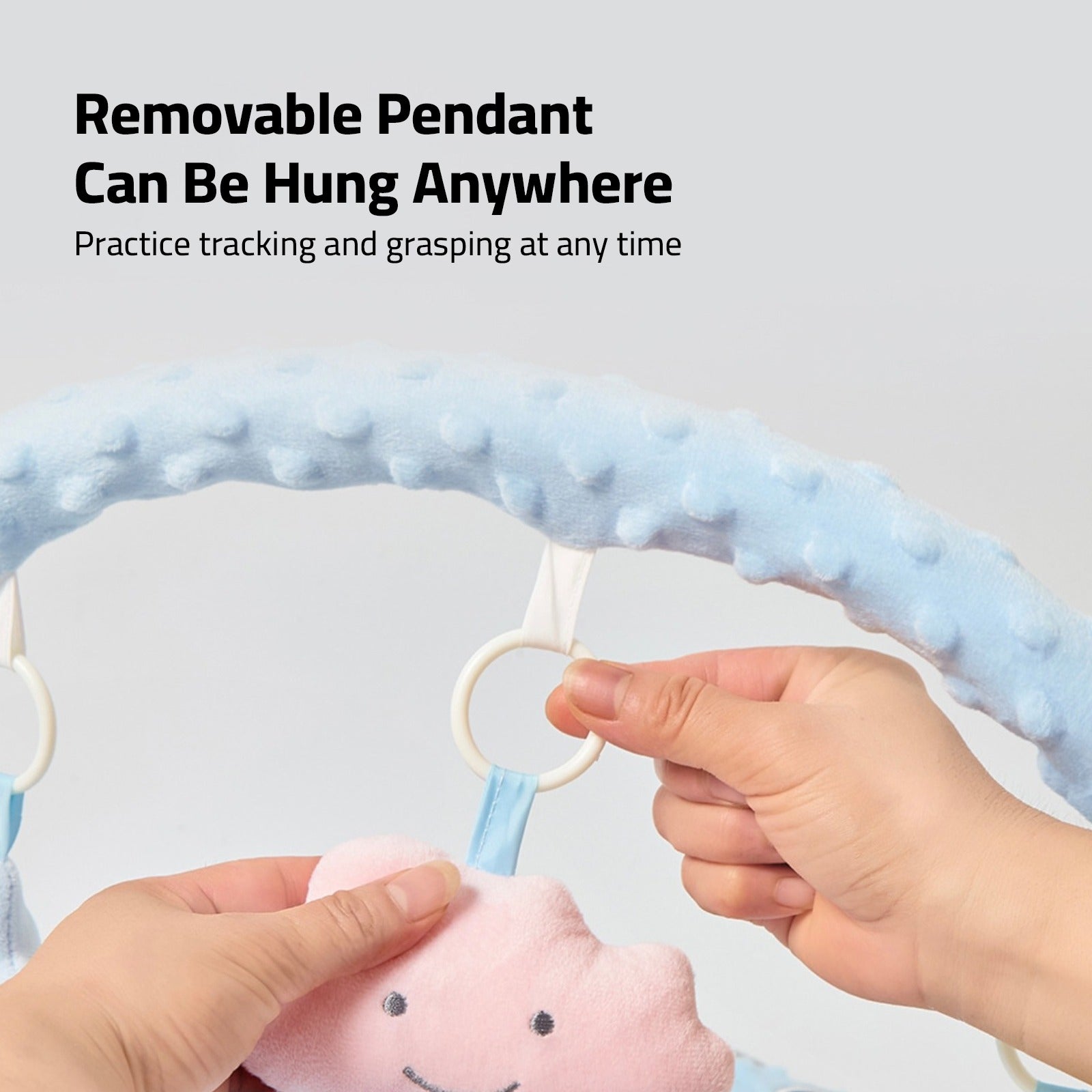 A Person is Holding Pendant Of the Comfortable Baby Nest Bed.