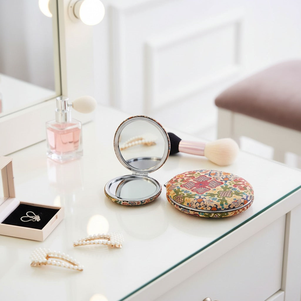 Compact Floral Pocket Mirror is Placed on Makeup Table.