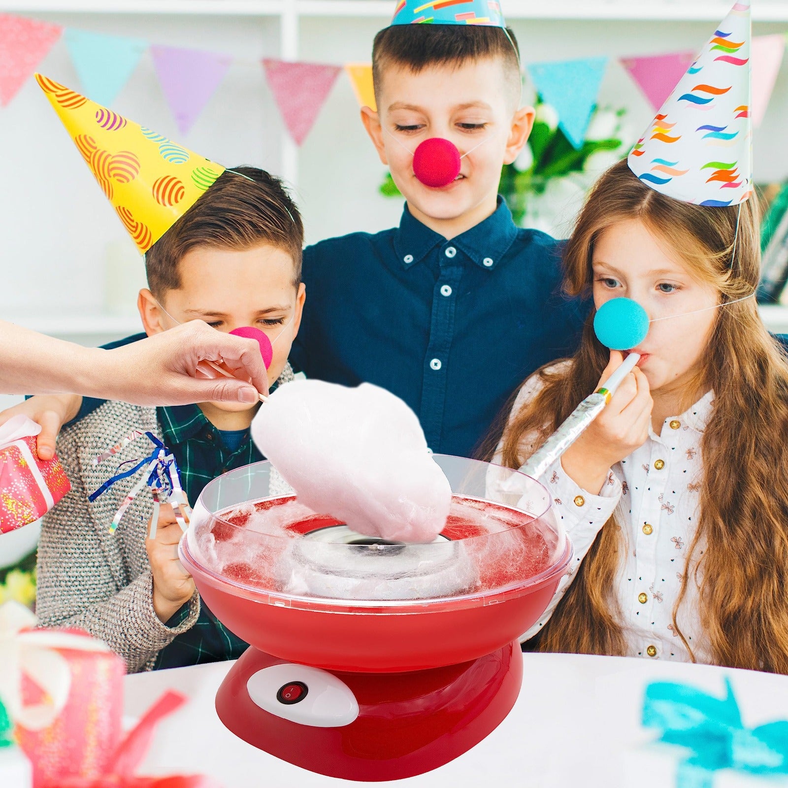 Kids are Waiting for Cotton Candy While a Person is Making it Using Cotton Candy Maker.
