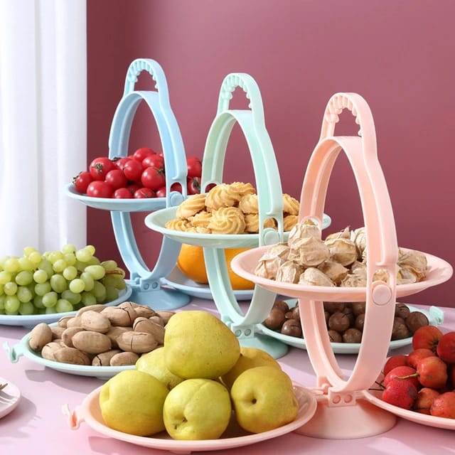 Fruits and snacks are arranged in a creative folding fruit plate.