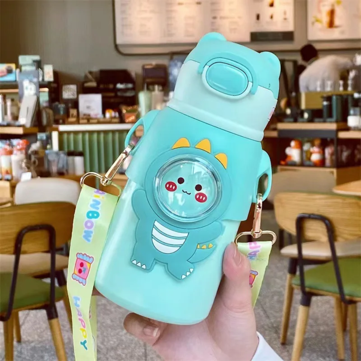 A Person is Holding Cute Cartoon Bear Water Bottle for Kids.