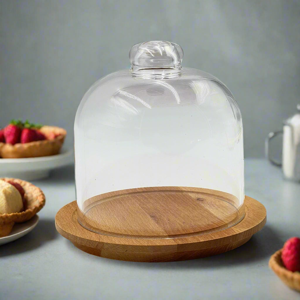A Desert Dome with Wooden Base is Placed in a Table.