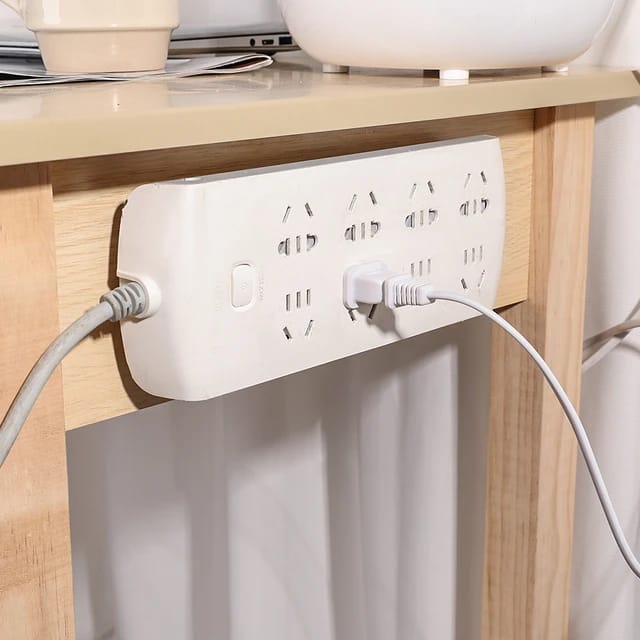 Extension Cord is Hanged On the Table Side Using Double Sided Adhesive Wall Hook Hanger Strip.
