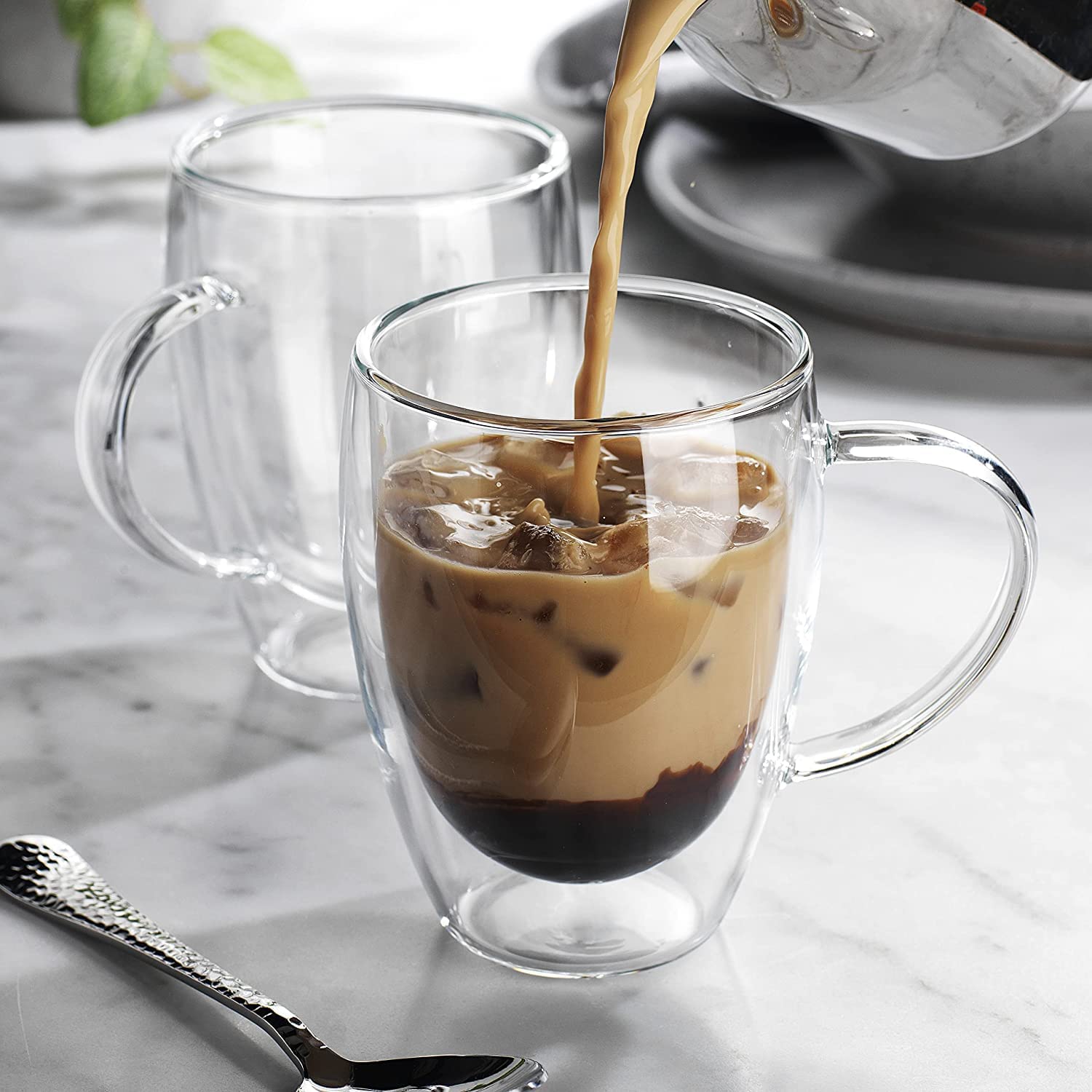 A Double Wall Glass Coffee Mug is Filled with Coffee.