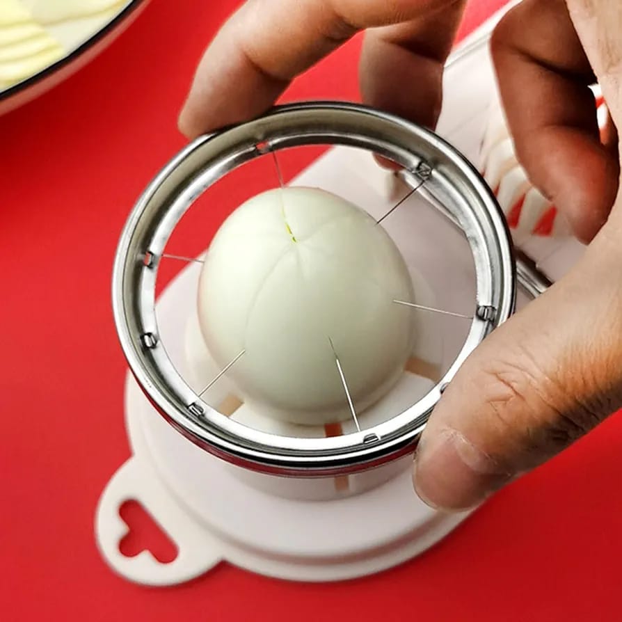 A Person is Slicing Egg Using Heavy Duty Manual Egg Slicer.