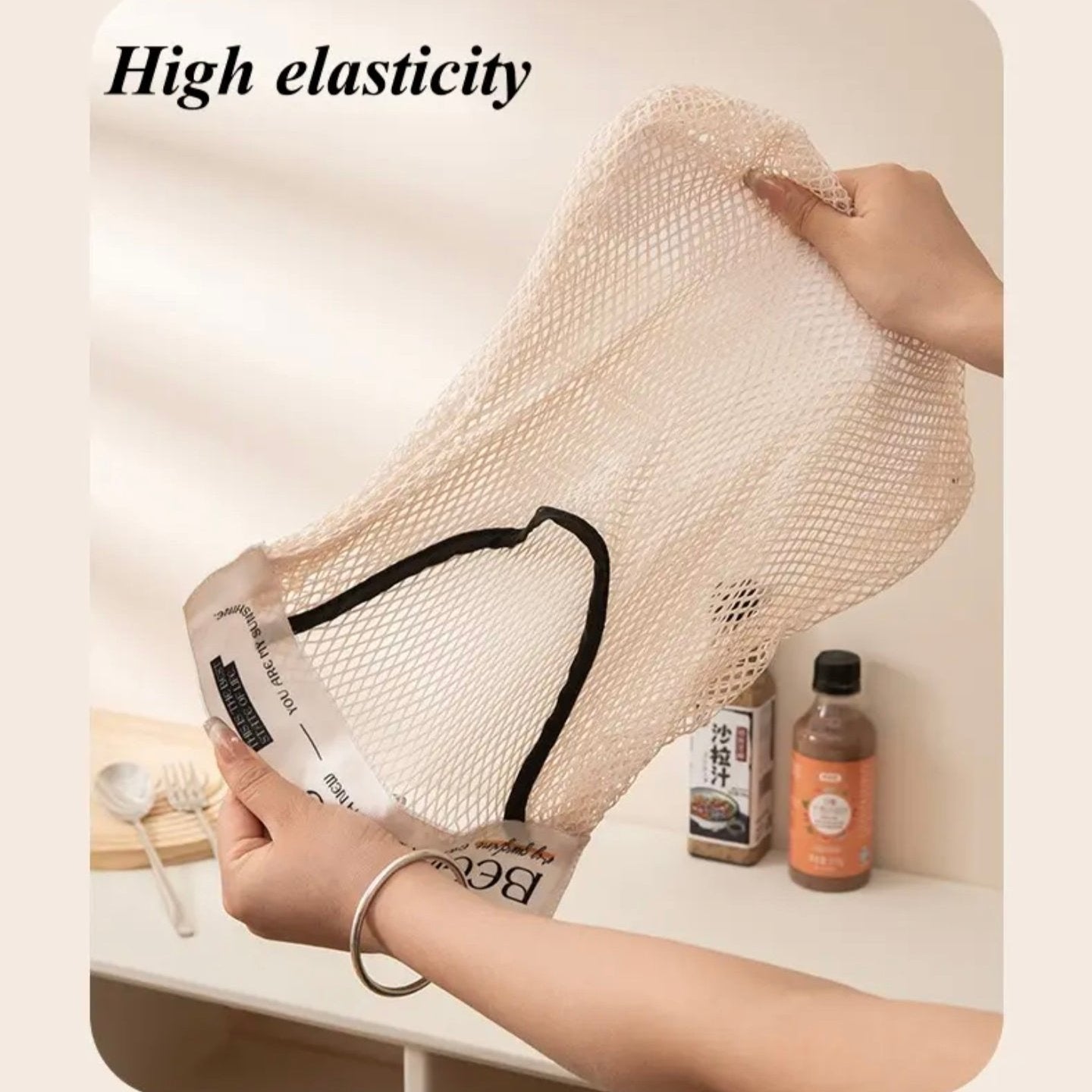 A Person is Holding Plastic Bags in a Sticky Wall Mounted Storage Organizer Bag.