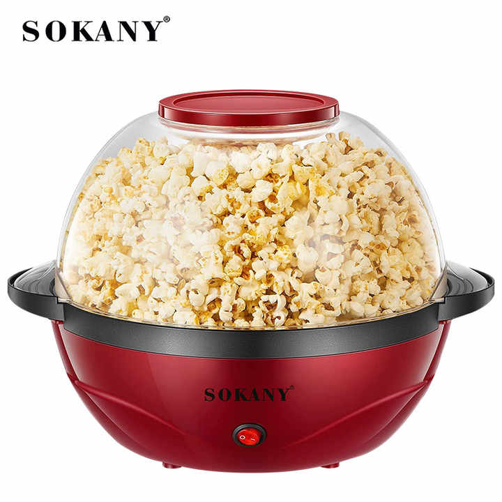 Electric Popcorn Maker With Popcorn In it.