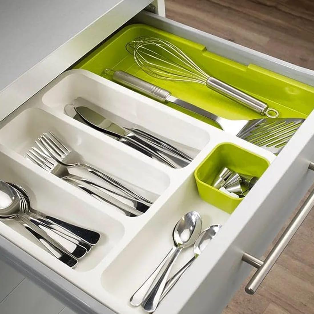 Kitchen Spoons and Cutleries are Kept at Expandable Cutlery Tray.