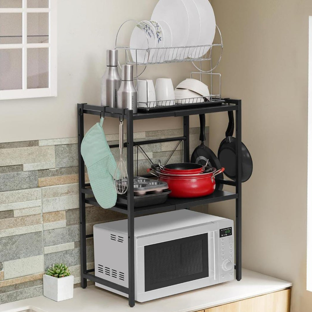 A Expandable Microwave Oven Rack Shelf is Organized with Oven and Kitchen Utensils.