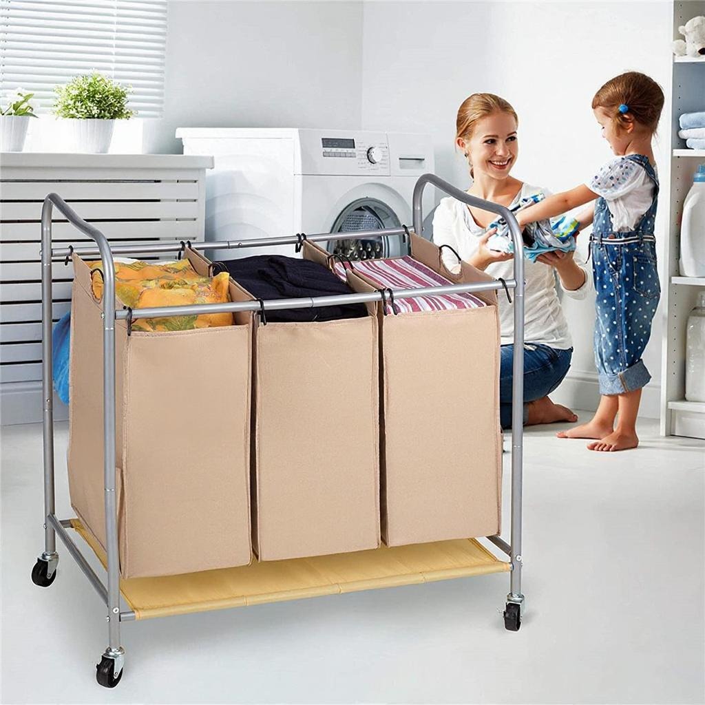 A Woman and Her Baby is Filling Laundry Clothes in to Heavy Duty Laundry Sorter Cart.
