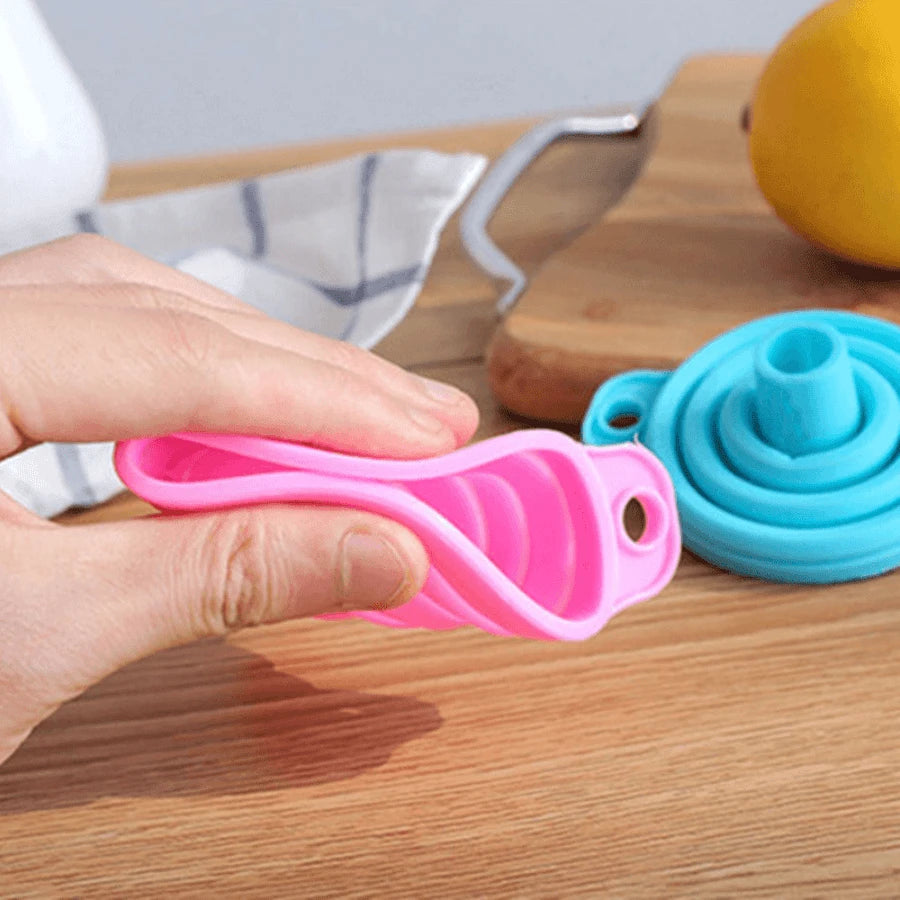 Someone is holding a Silicone Telescopic Collapsible Mini Funnel for Liquid