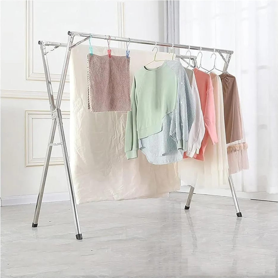 A Foldable Cloth Drying Rack with Cloths are Hanged on it.