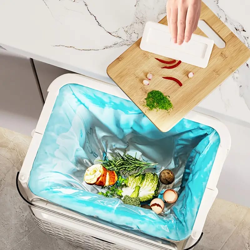 Garbage is throwing to Foldable Hanging Kitchen Trash.