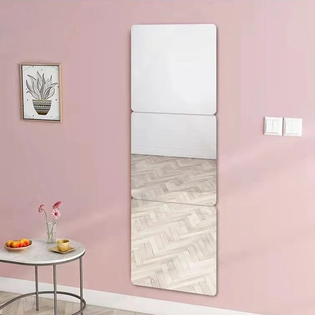 HD Self-Adhesive Acrylic Mirror elegantly placed on the wall in front of a tea table, adorned with fruits