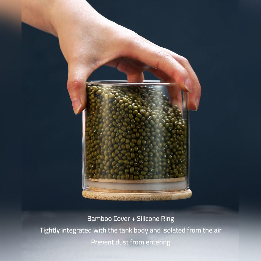 A Person is Holding Glass Storage Jar Upside Down.