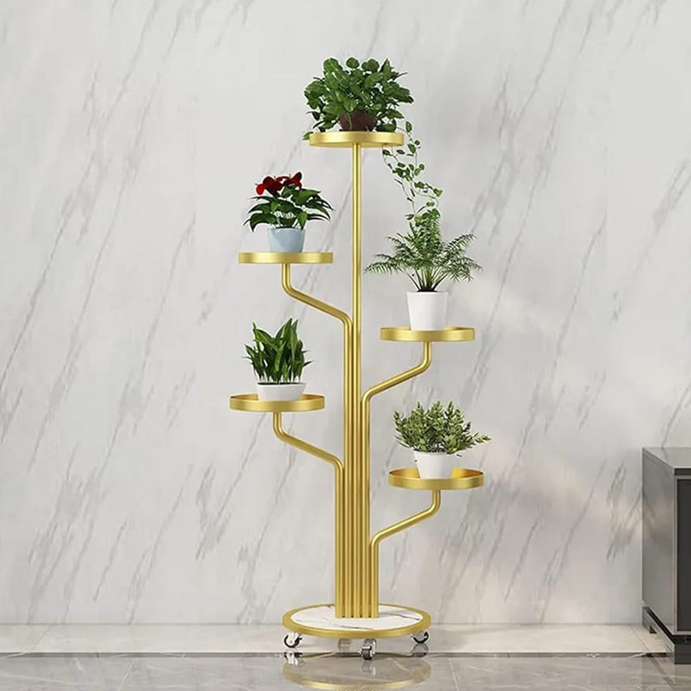 Golden color Indoor Plant Stands placed in a room along with plants.