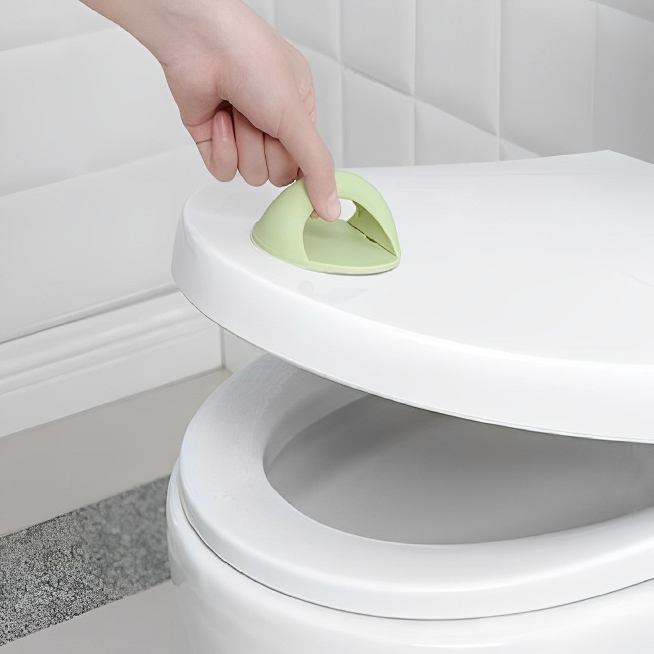 A Person is Opening Toilet Lid Using Adhesive Toilet Seat Lifter.