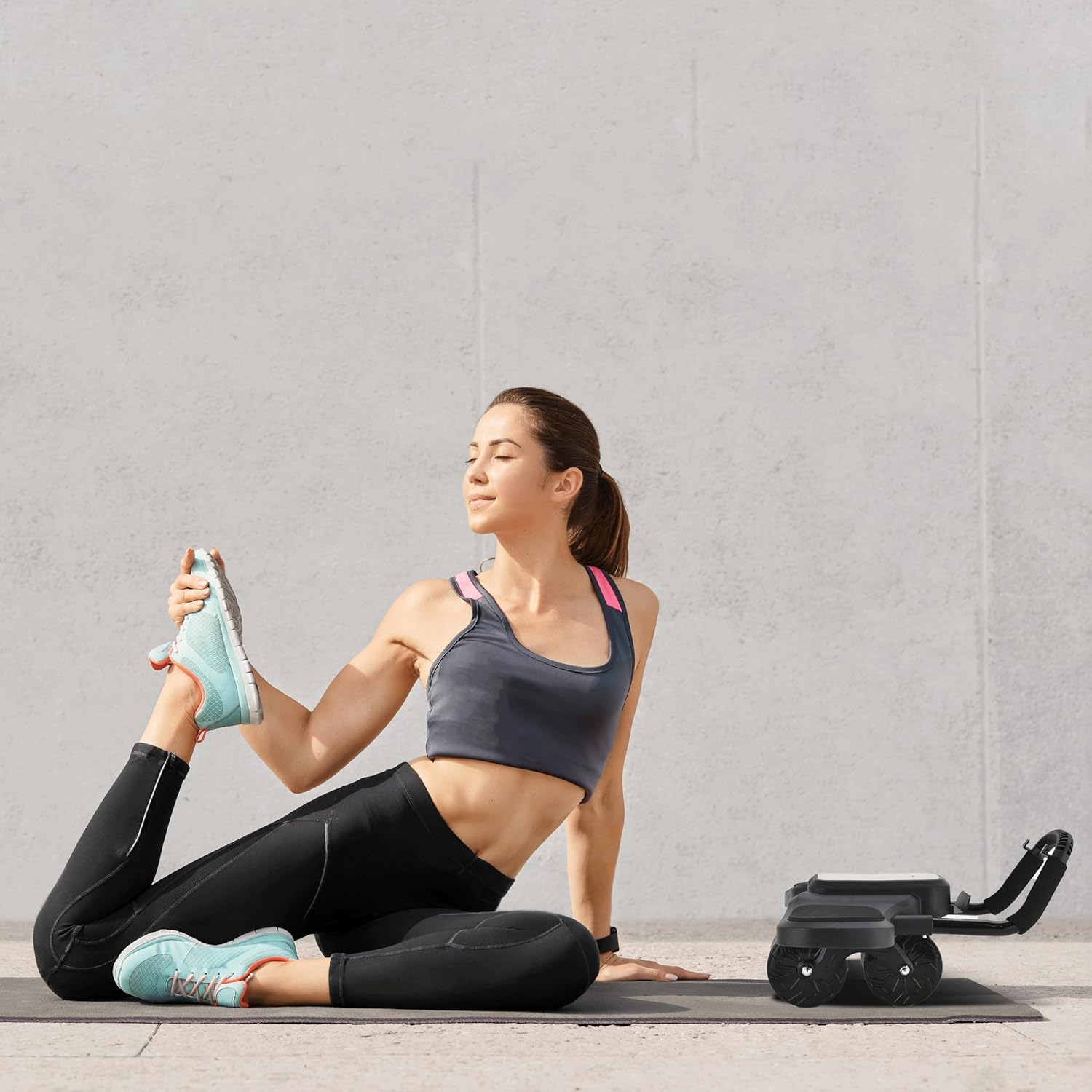 A Woman is Working Out Using Green Lion ABS Exercise Roller.