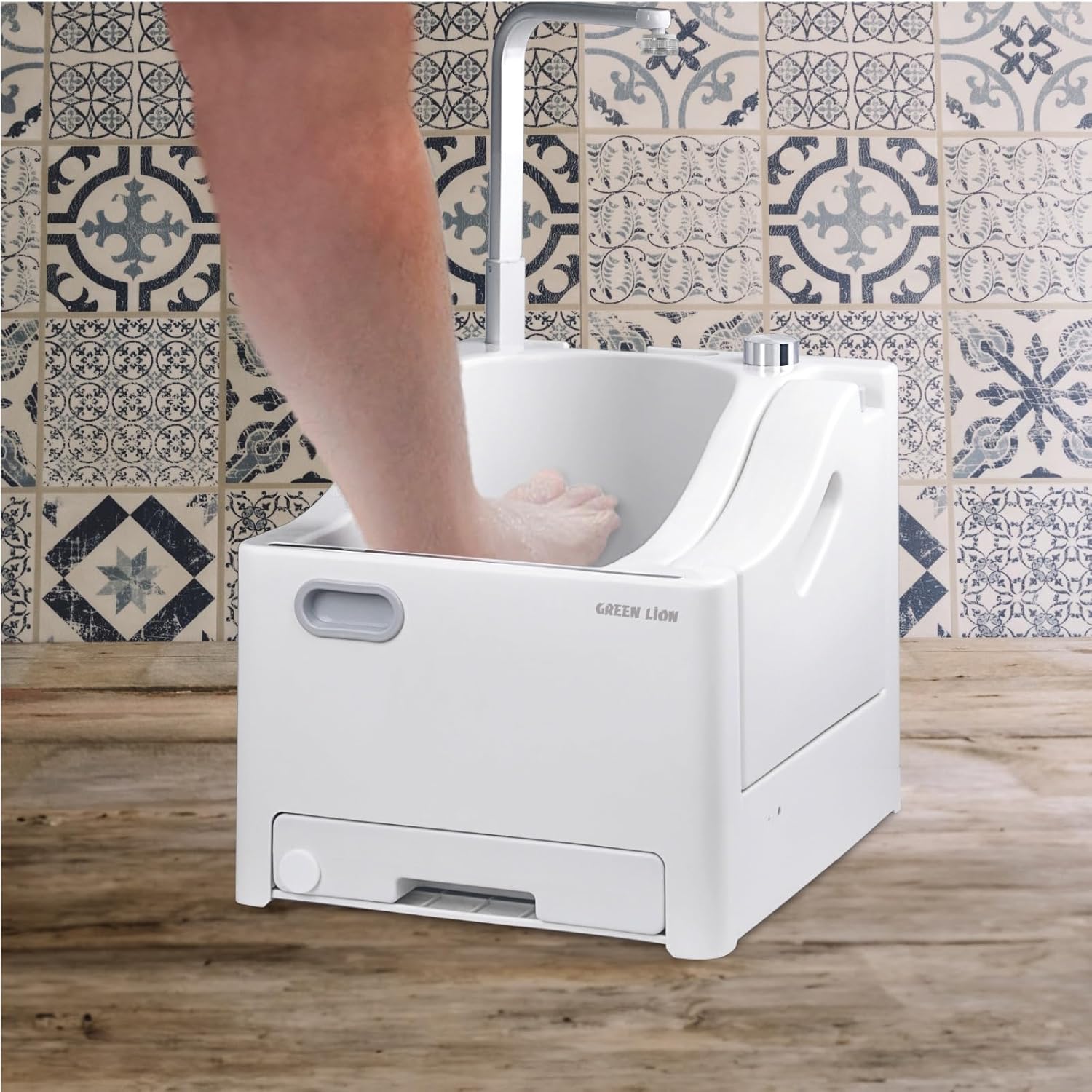 A Person is Washing His Leg in a Green Lion GWM-10 Portable Wudu Machine.