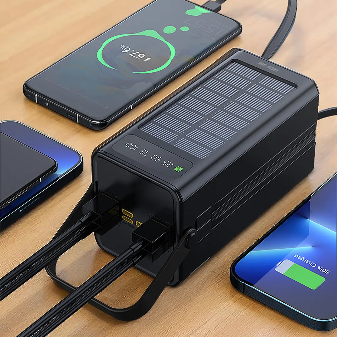 Black Green Lion Solar X 60000mAh Power Bank with multiple charging cables on a wooden surface