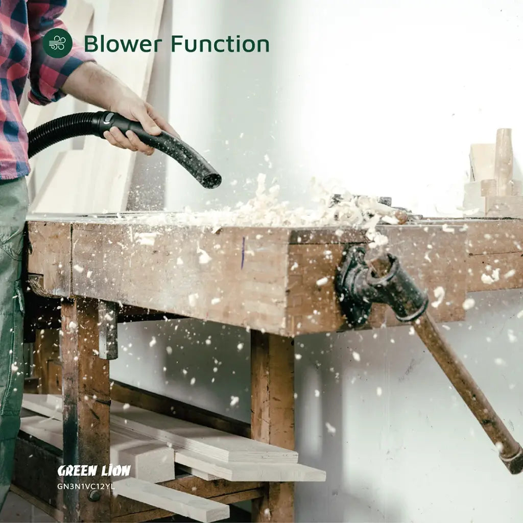 A Person is Cleaning His Working Area Using Green Lion Ultra 3 In 1 Vacuum Cleaner.