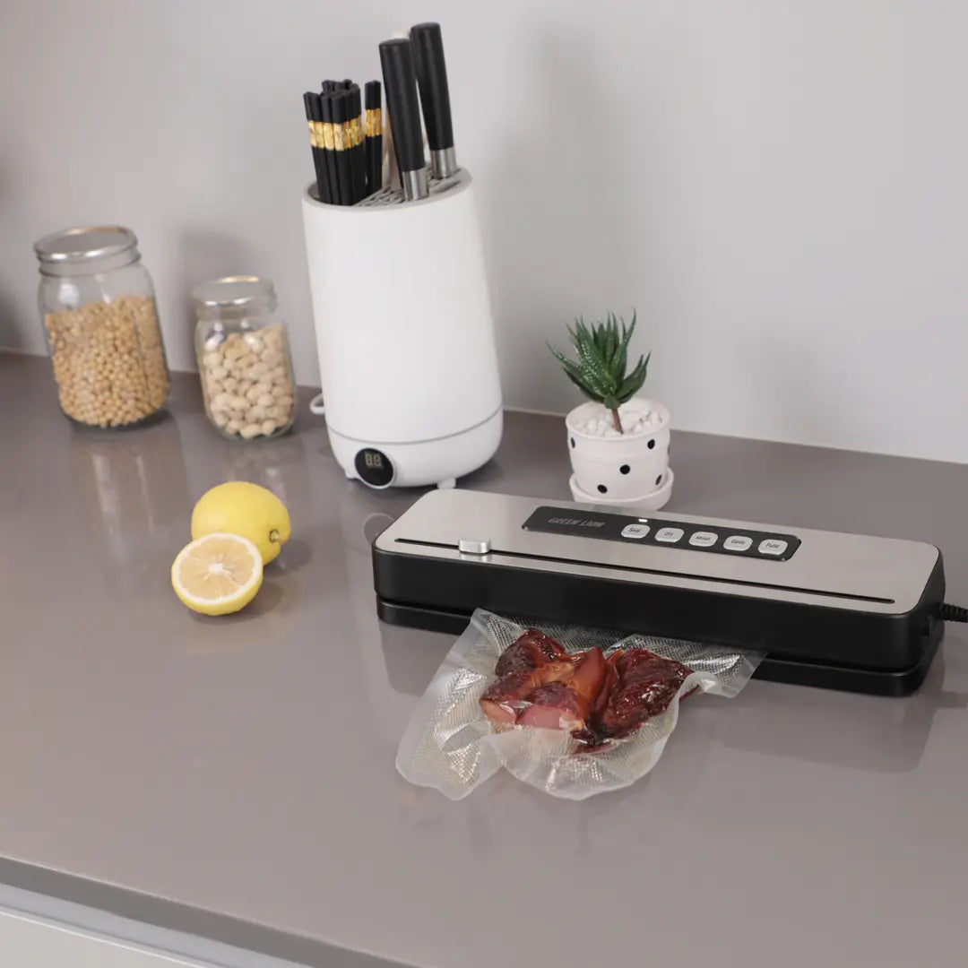 A Green Lion Vacuum Sealer Pro is Sealing a Food Product.