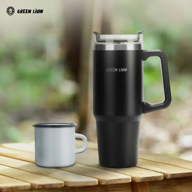 Green Lion Vacuum Travel Mug is Placed Along With a Cup.