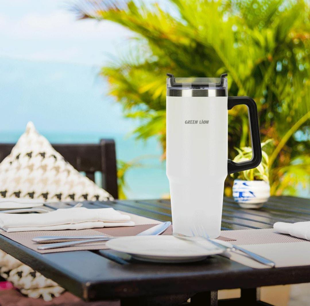 A Green Lion Vacuum Travel Mug is Taken for Outing.