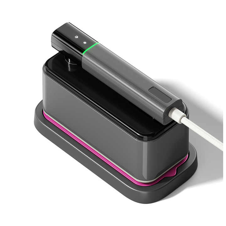 A Grey Handheld Travel Garment Iron Steamer.