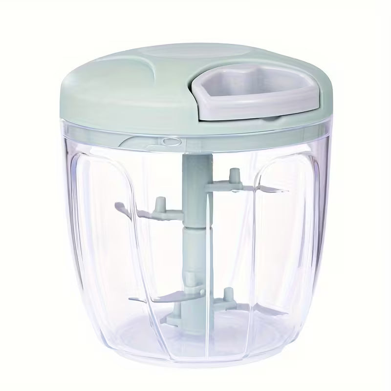 Handheld food chopper with a clear container and light green lid on a white background