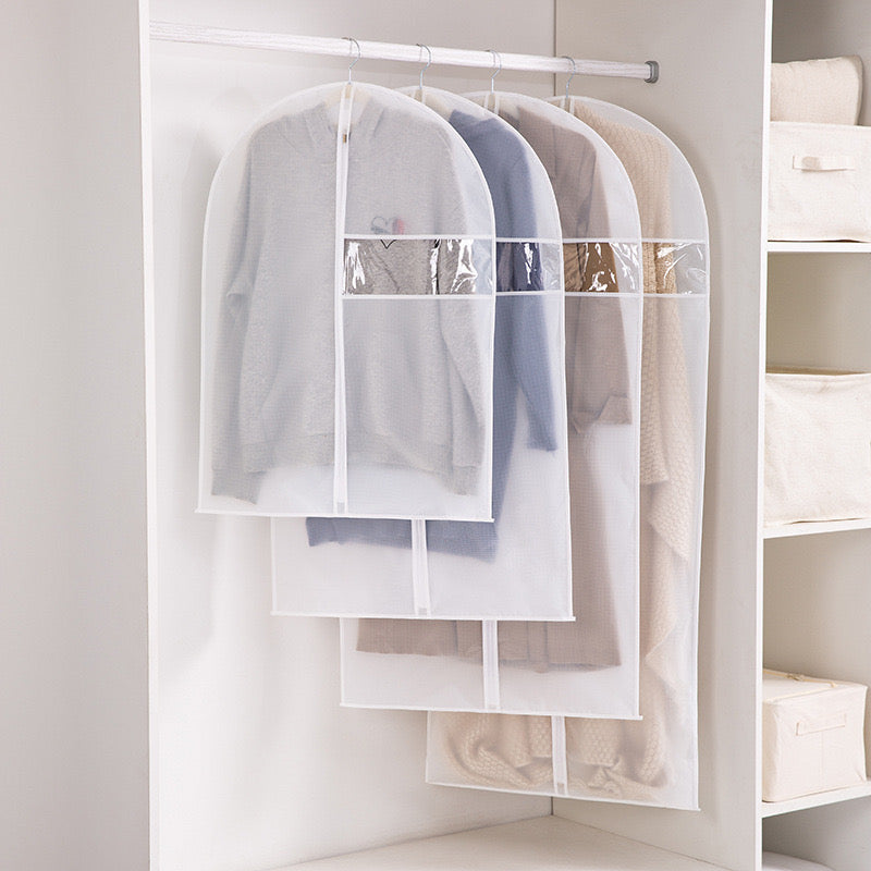 Hanging Garment Bags with some clothes