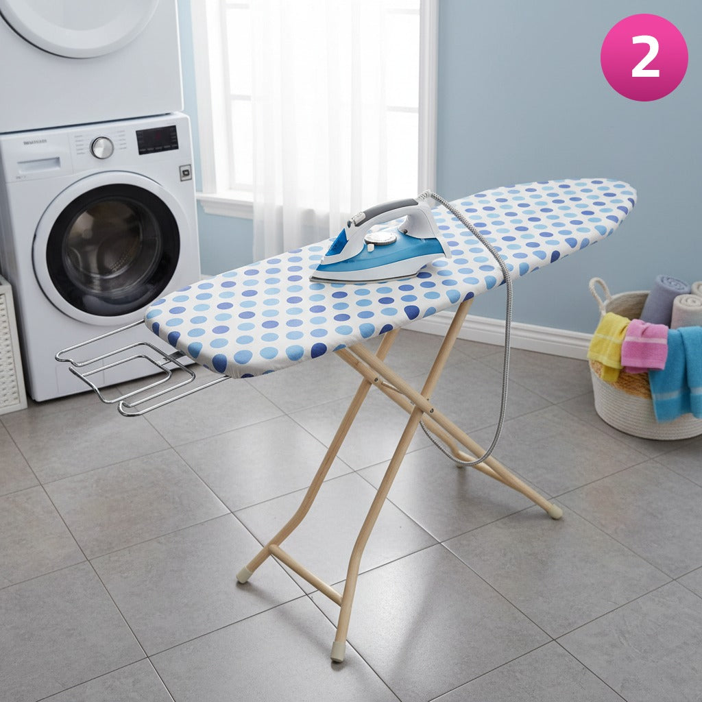 Heavy-duty folding ironing board with iron and clothes set up in a laundry area.