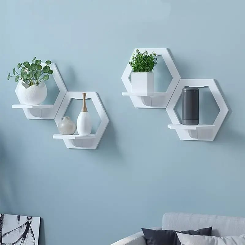 Hexagon Wall Organizer Shelf With Decor Items On It.
