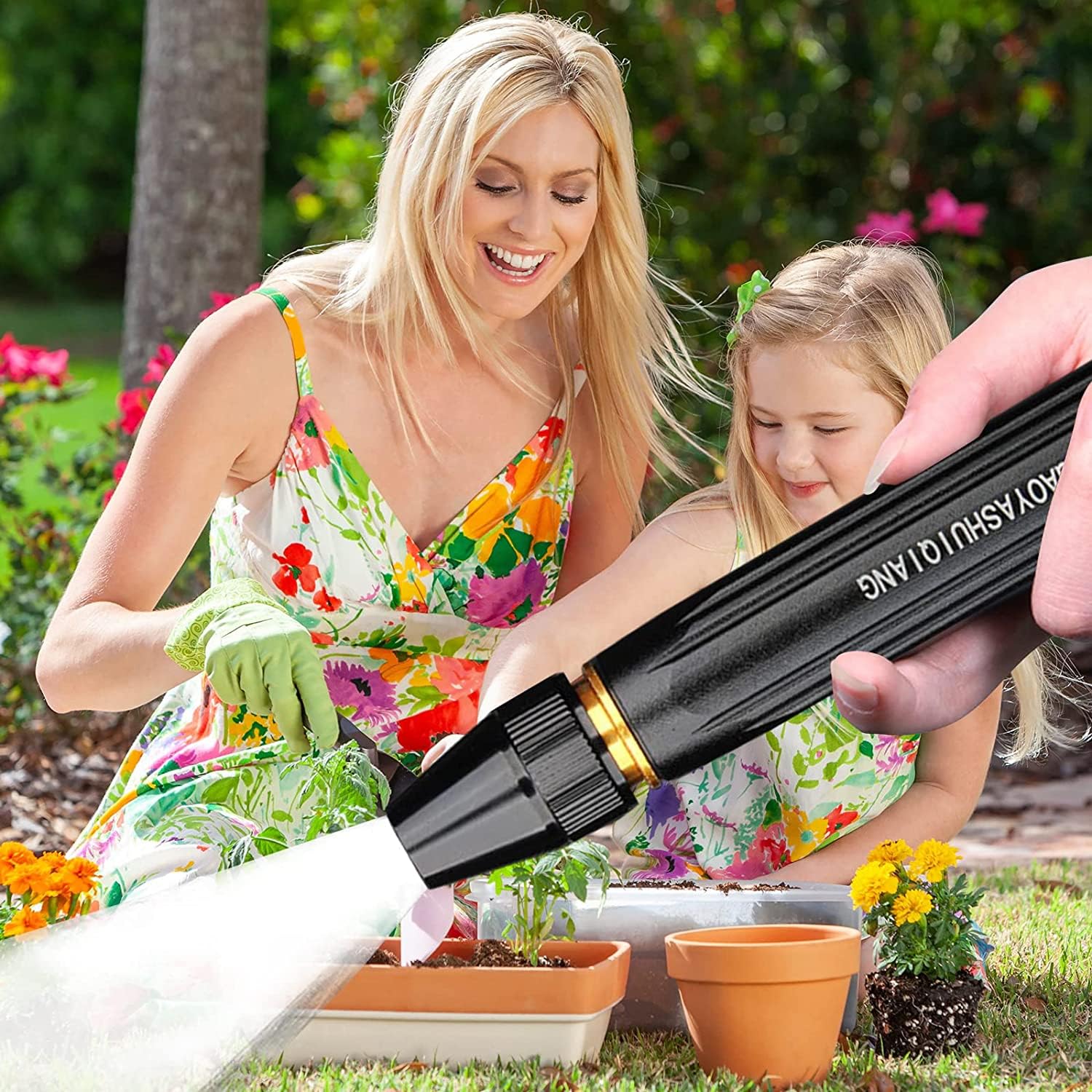 A Mother and Child Uses High Pressure Car Washing Water Spray Gun Set for Watering Plants.