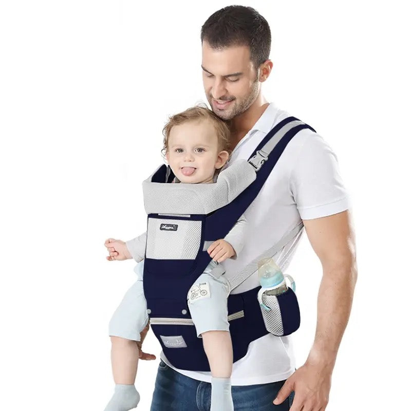 A man carrying with the help of an All-Position Baby Carrier