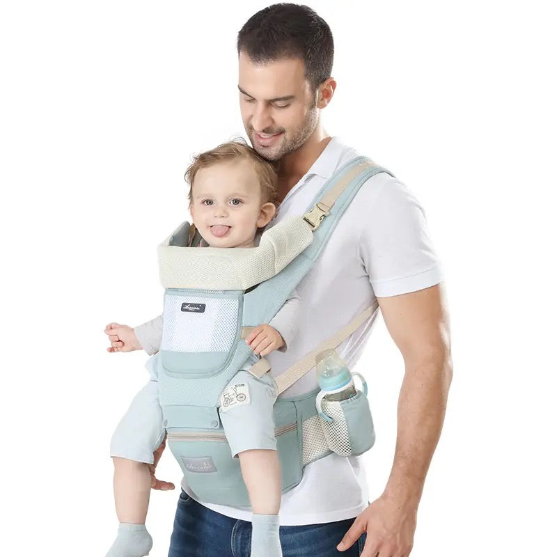 A man carrying with the help of an All-Position Baby Carrier