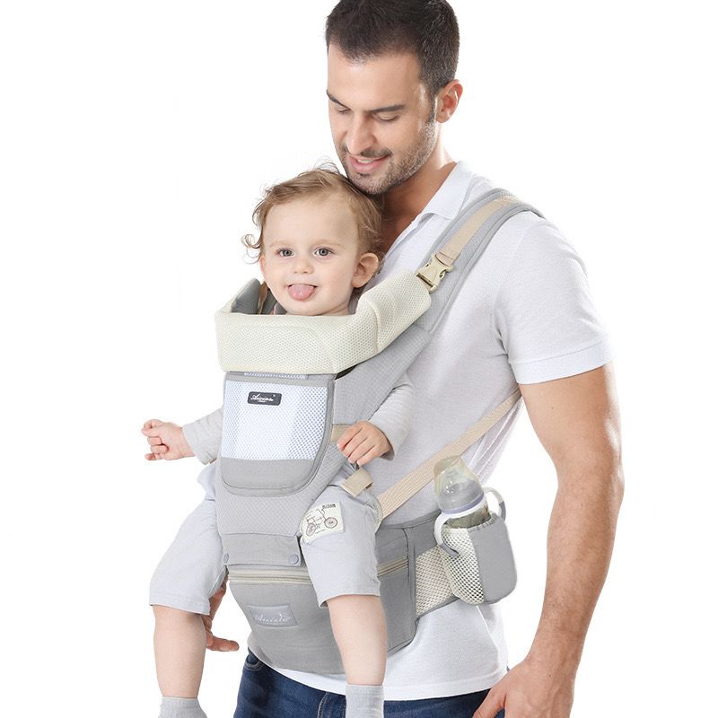 A man carrying with the help of an All-Position Baby Carrier