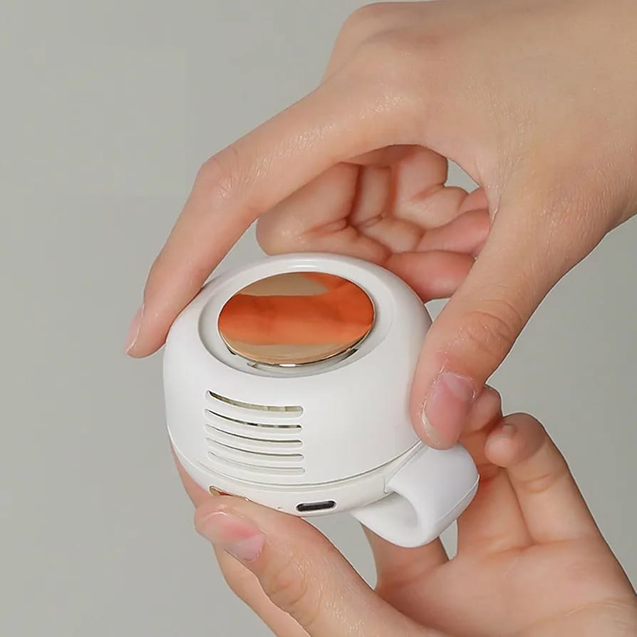 A Person is Holding Pocket Clip Fan.