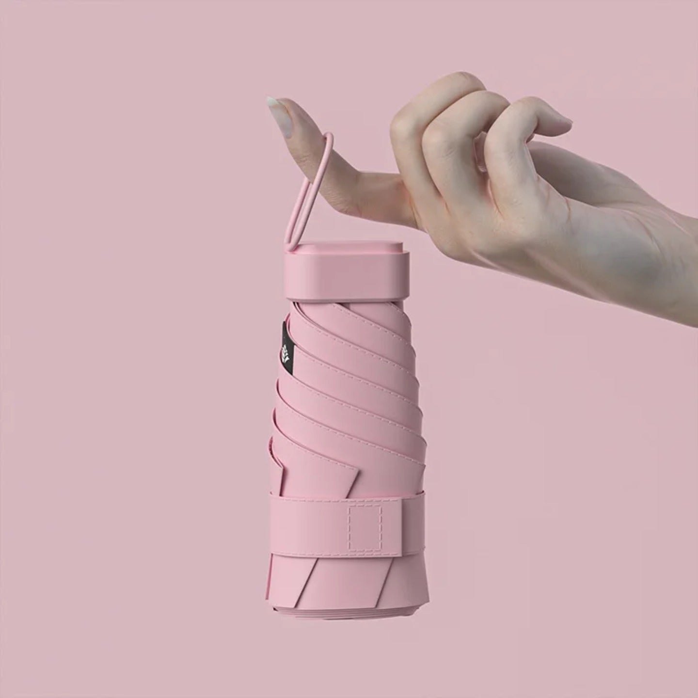 A Person is Holding Travel Mini Folding Pocket Umbrella.