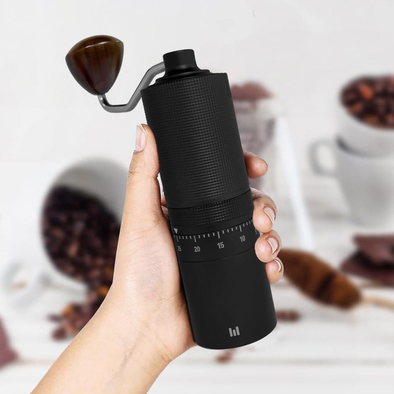 A Person is Holding Macnoa MacGrind Craft - Manual Hand Coffee Bean Grinder.