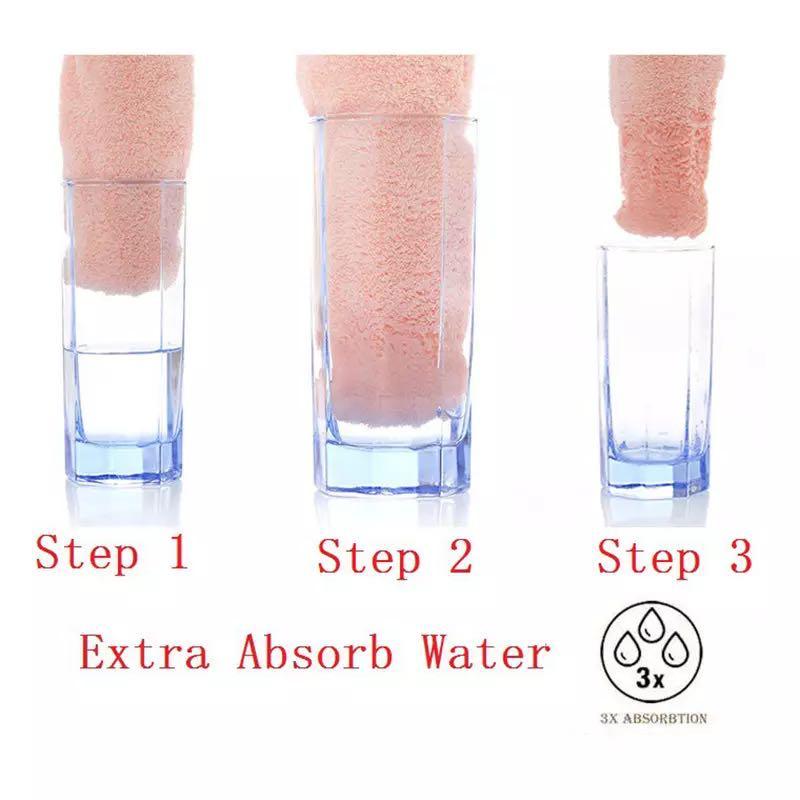 A lady showing a bath towel set for kids and adults