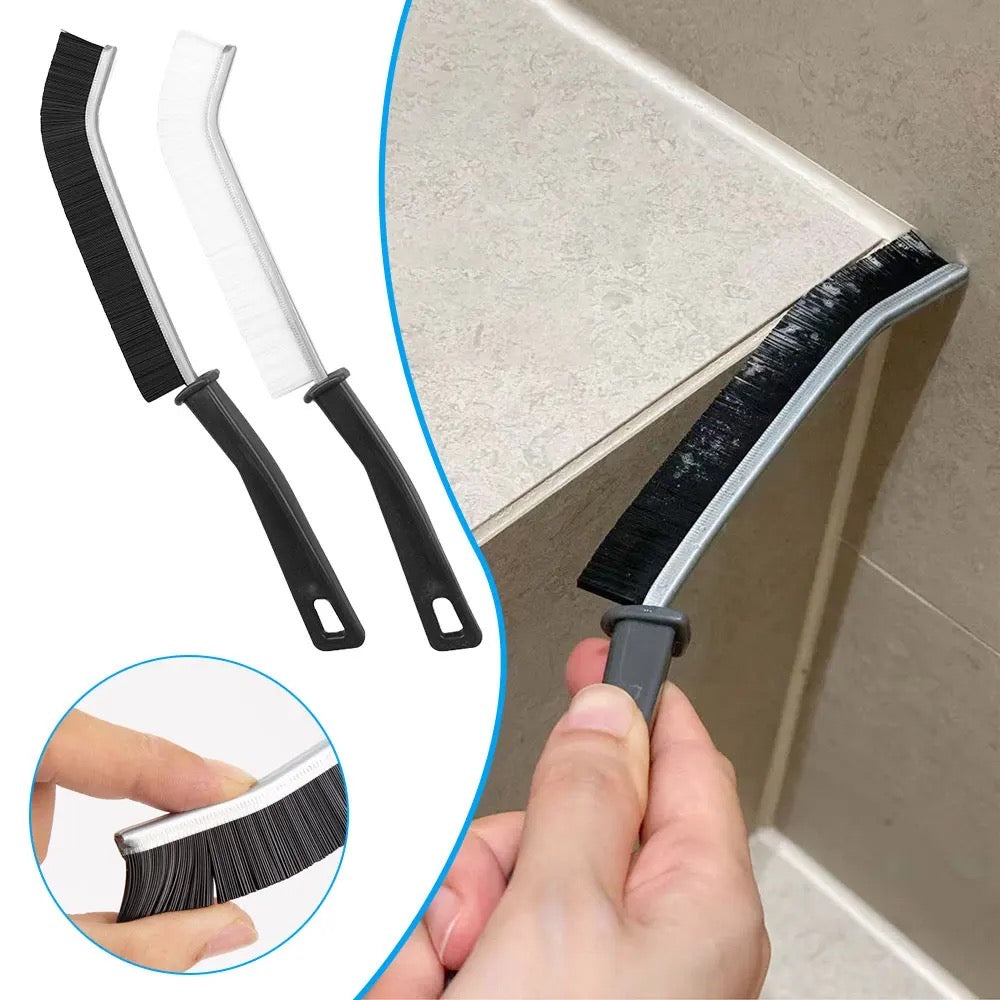 Someone is cleaning the gaps in tiles with the help of a Gap Cleaning Brush