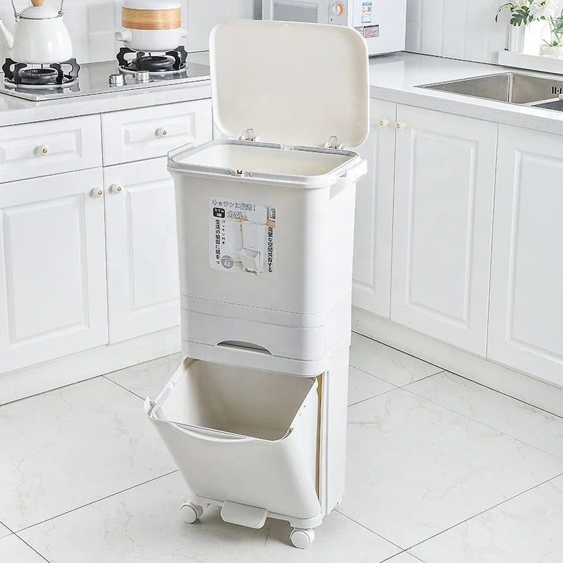 A white kitchen trash can with a lid, suitable for disposing of large garbage in the kitchen