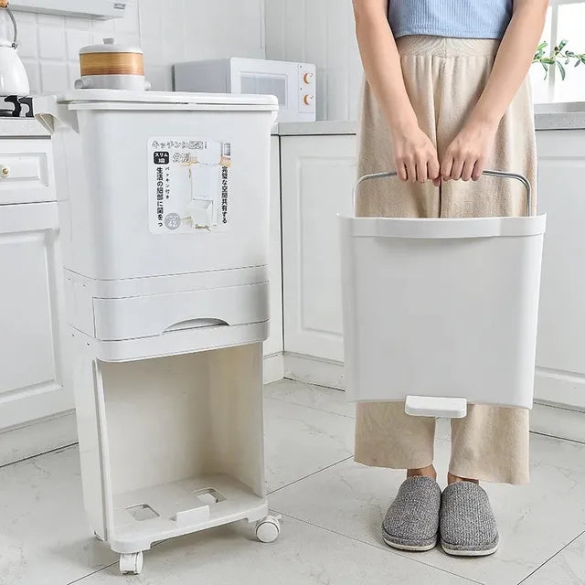 A white kitchen trash can with a lid, suitable for disposing of large garbage in the kitchen