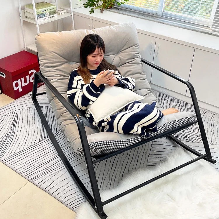 a woman lies on a Relaxing Rocking Chair,