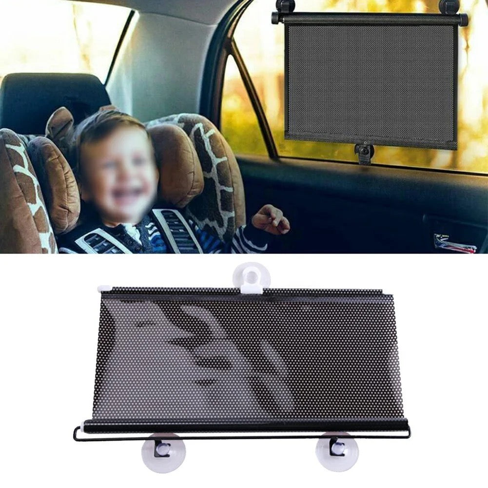 A young child sitting in a car seat with a retractable car sun shade blocking the sunlight