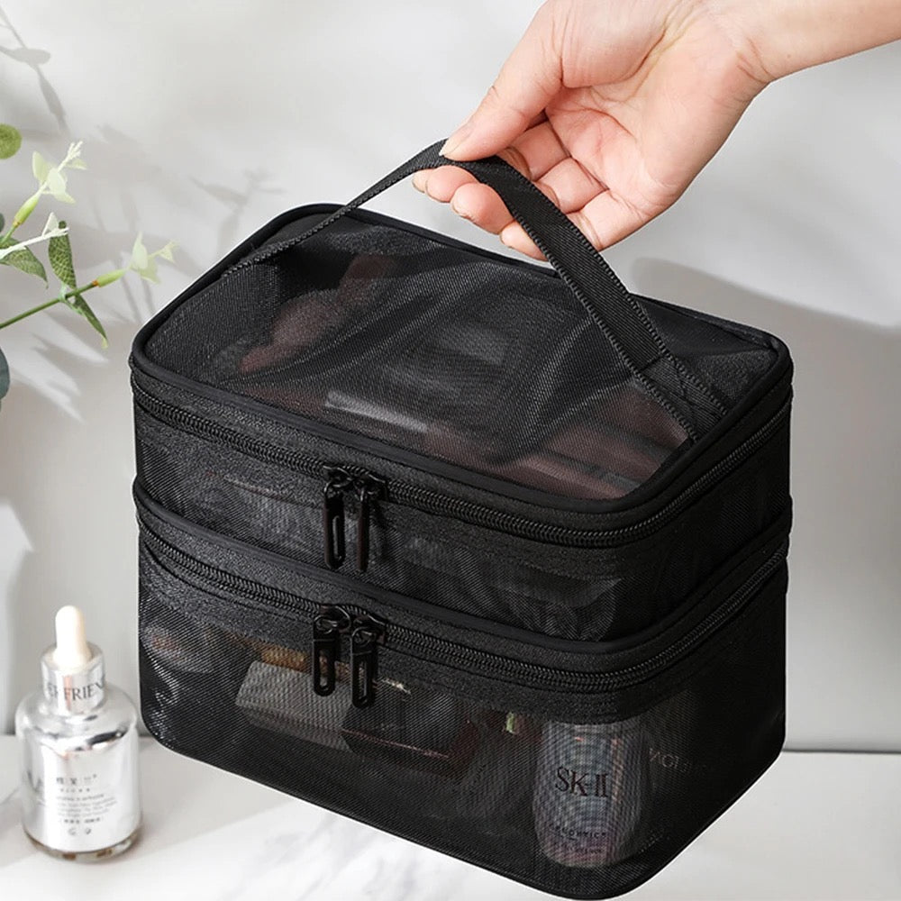 Someone holding a double-layer mesh cosmetic bag