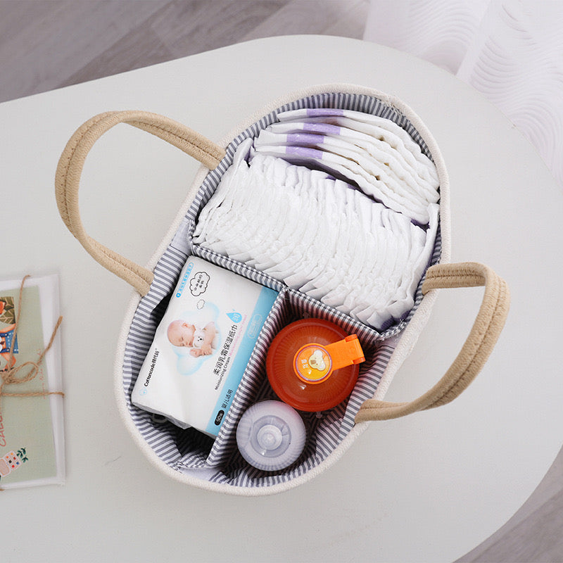 Image shows the top view of neatly and well organized items inside Nursery Storage Basket