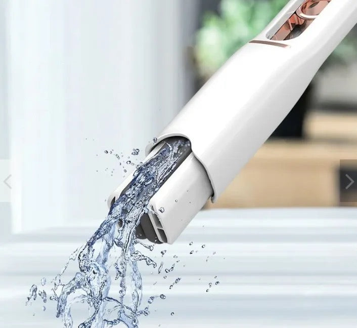 Multi-Purpose Self-Squeeze Mini Mop with water coming out of it