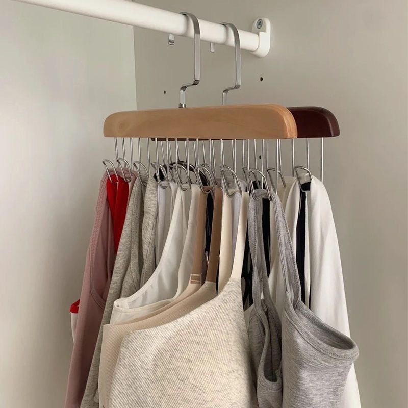 A rack with clothes hanging on 8 hooks non-slip hanger, perfect for organizing your wardrobe.